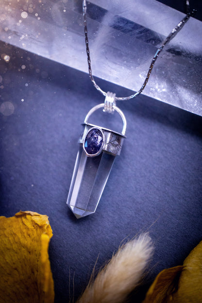 Beautiful, handmade Iolite and quartz crystal point pendant necklace. This pendant is a statement and has been handcrafted out of recycled fine and sterling silver. Featuring southwest stamp detail along the bezel. Ideal for crystal lovers, gothic.