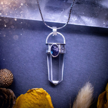 Beautiful, handmade Iolite and quartz crystal point pendant necklace. This pendant is a statement and has been handcrafted out of recycled fine and sterling silver. Featuring southwest stamp detail along the bezel. Ideal for crystal lovers, gothic.