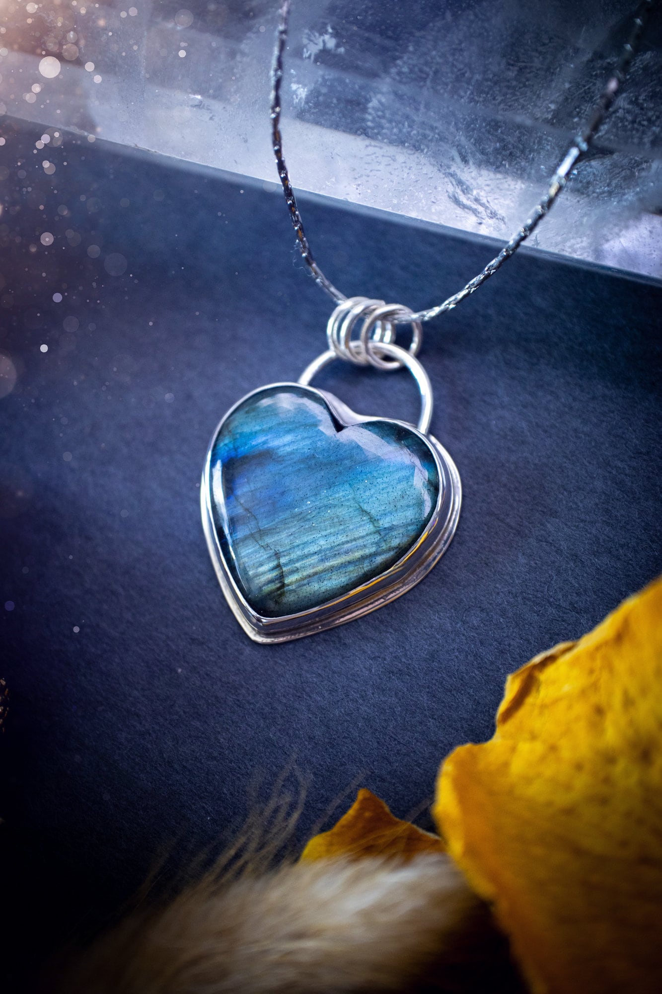 Bold and beautiful, blue and green flash, Labradorite crystal heart pendant necklace. This pendant has been handcrafted out of fine and sterling silver. The piece is minimal yet unique. Suitable for jewellery gifts. Gothic, hippy and ideal for her.