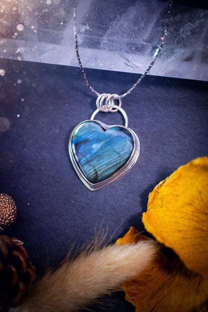 Bold and beautiful, blue and green flash, Labradorite crystal heart pendant necklace. This pendant has been handcrafted out of fine and sterling silver. The piece is minimal yet unique. Suitable for jewellery gifts. Gothic, hippy and ideal for her.