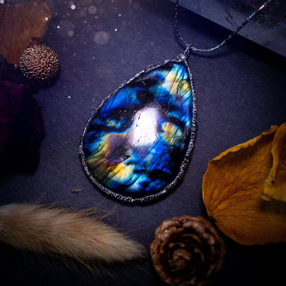 Beautiful, flashy labradorite crystal which has been soft soldered to create a stunning pendant necklace. Natural crystal gemstone with lead free solder, a beautiful gift for any crystal lover. Witchy and gothic style jewellery, gifts for her.