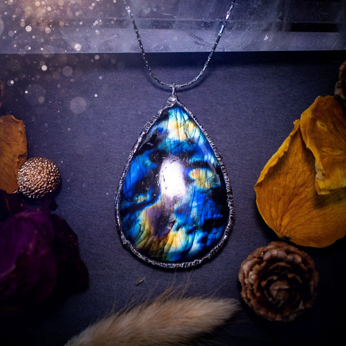 Beautiful, flashy labradorite crystal which has been soft soldered to create a stunning pendant necklace. Natural crystal gemstone with lead free solder, a beautiful gift for any crystal lover. Witchy and gothic style jewellery, gifts for her.