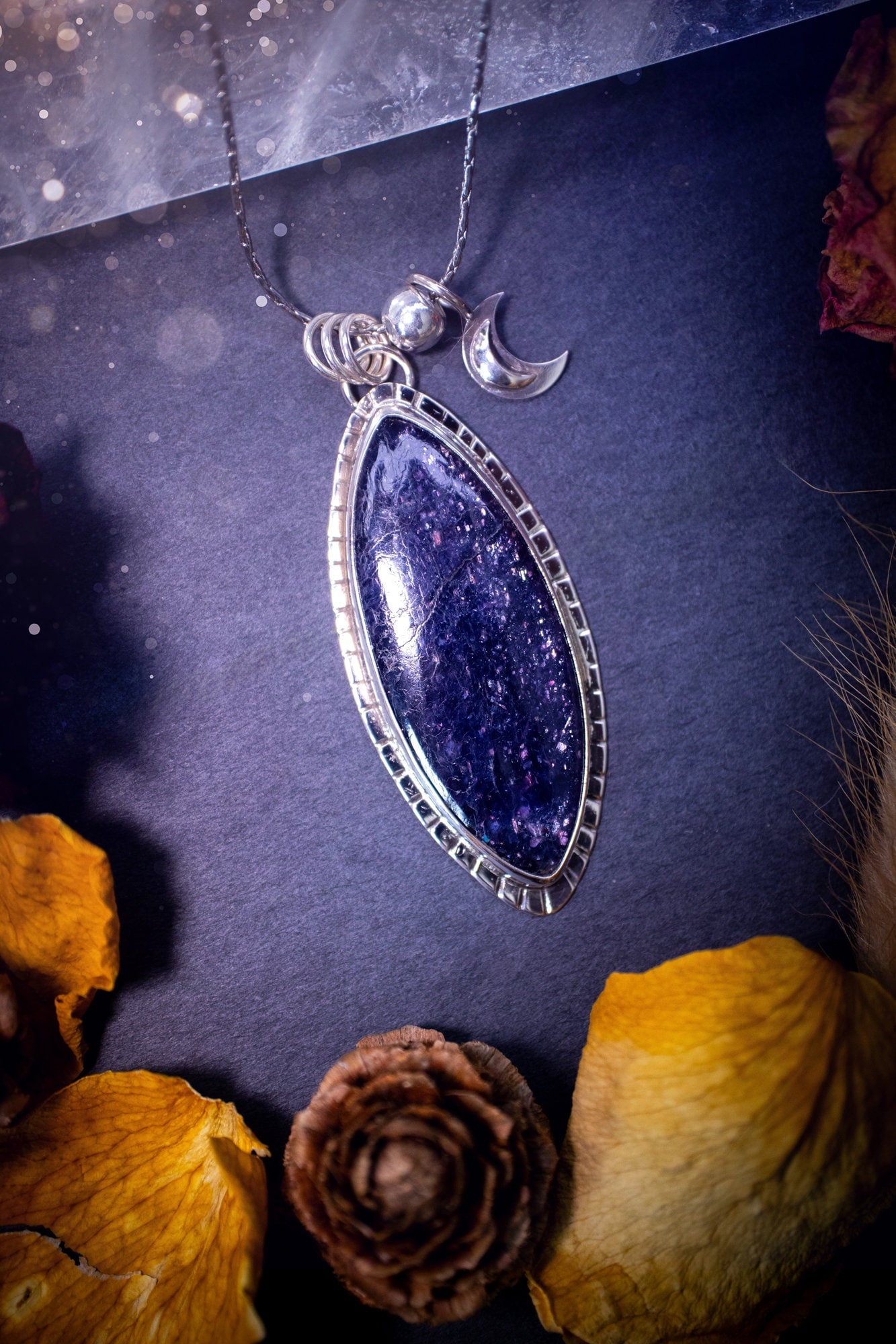 Handcrafted, beautiful, Iolite Sunstone crystal pendant necklace. Featuring a gorgeous sparkly Iolite gemstone, and made from recycled sterling silver. Accompanied by a little moon charm. Ideal gift for crystal and jewellery lovers. Hippy and Gothic