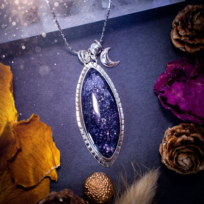 Handcrafted, beautiful, Iolite Sunstone crystal pendant necklace. Featuring a gorgeous sparkly Iolite gemstone, and made from recycled sterling silver. Accompanied by a little moon charm. Ideal gift for crystal and jewellery lovers. Hippy and Gothic