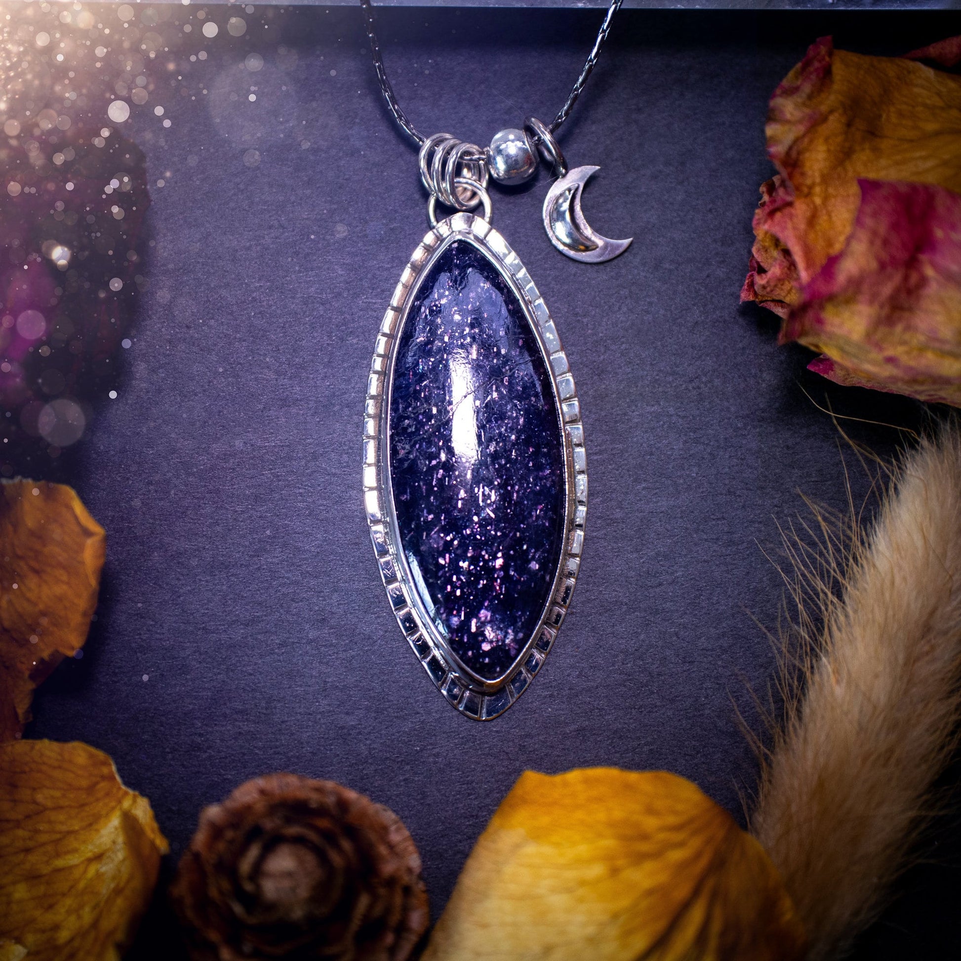 Handcrafted, beautiful, Iolite Sunstone crystal pendant necklace. Featuring a gorgeous sparkly Iolite gemstone, and made from recycled sterling silver. Accompanied by a little moon charm. Ideal gift for crystal and jewellery lovers. Hippy and Gothic