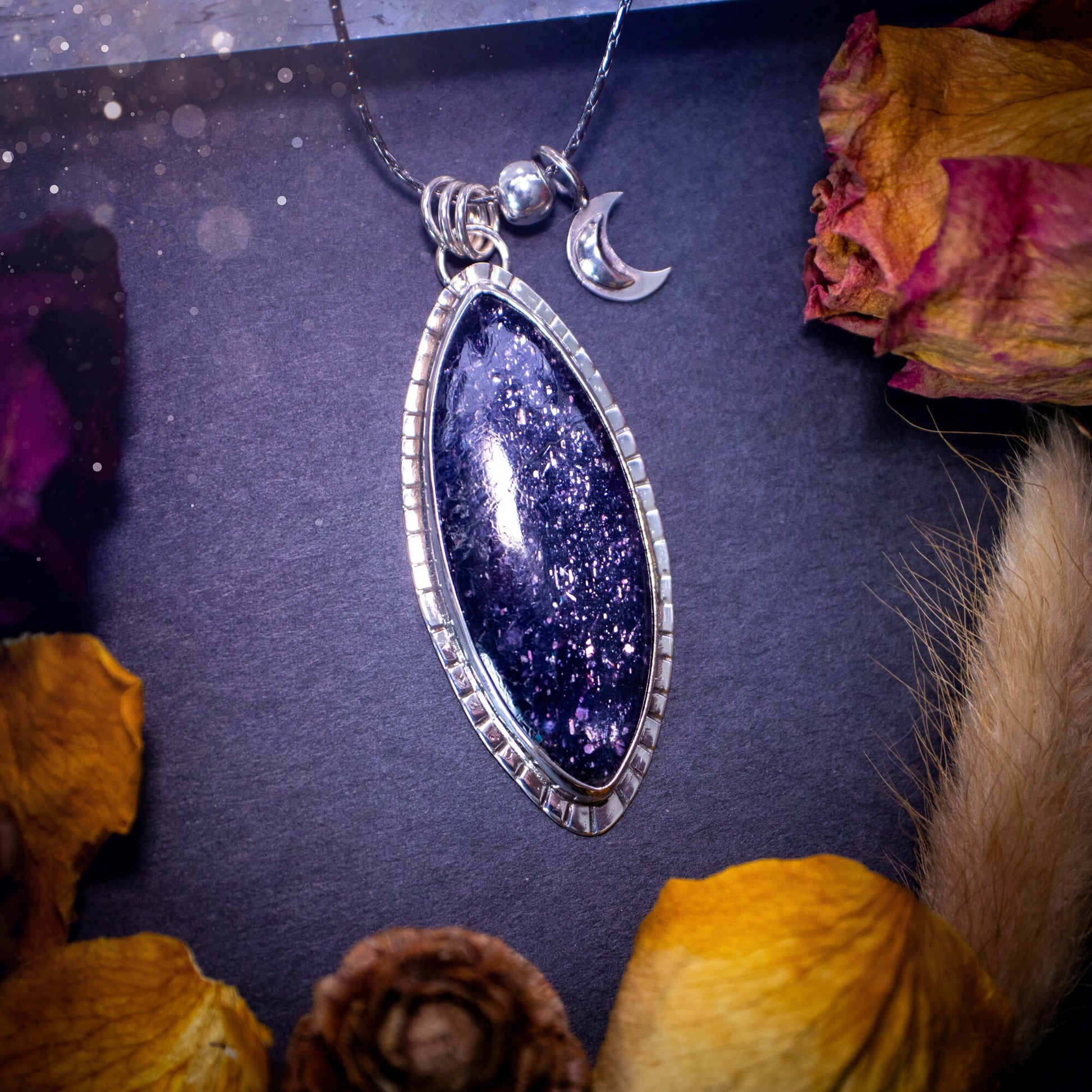 Handcrafted, beautiful, Iolite Sunstone crystal pendant necklace. Featuring a gorgeous sparkly Iolite gemstone, and made from recycled sterling silver. Accompanied by a little moon charm. Ideal gift for crystal and jewellery lovers. Hippy and Gothic