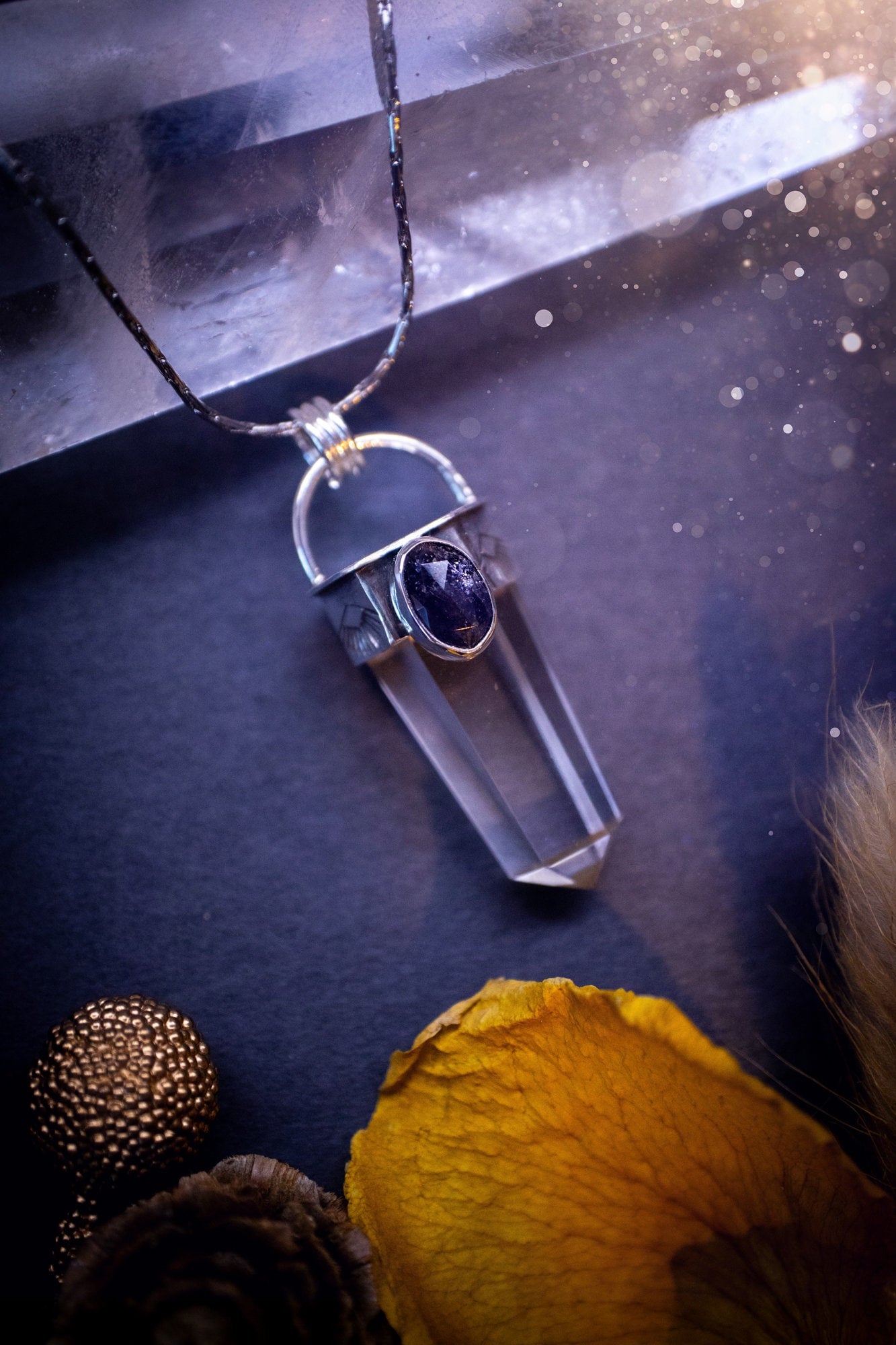 Beautiful, handmade Iolite and quartz crystal point pendant necklace. This pendant is a statement and has been handcrafted out of recycled fine and sterling silver. Featuring southwest stamp detail along the bezel. Ideal for crystal lovers, gothic.