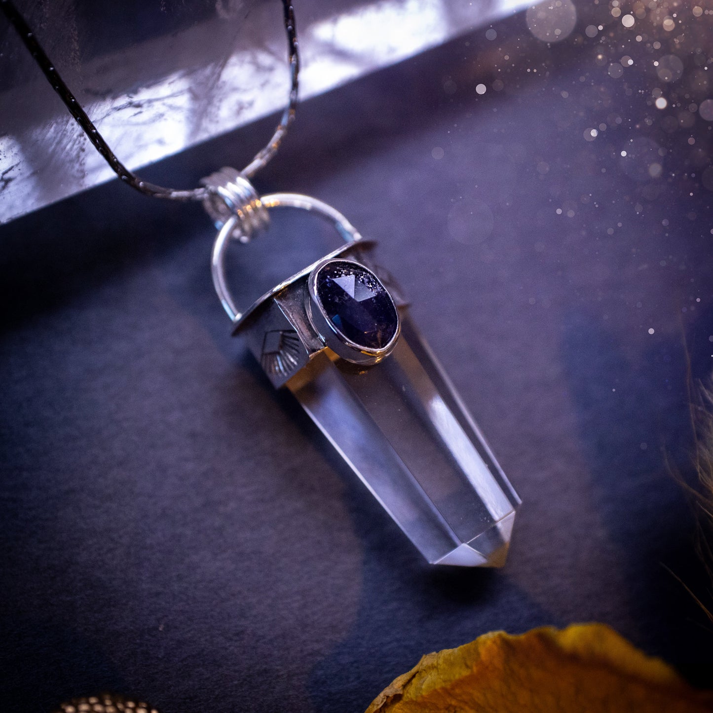 Beautiful, handmade Iolite and quartz crystal point pendant necklace. This pendant is a statement and has been handcrafted out of recycled fine and sterling silver. Featuring southwest stamp detail along the bezel. Ideal for crystal lovers, gothic.