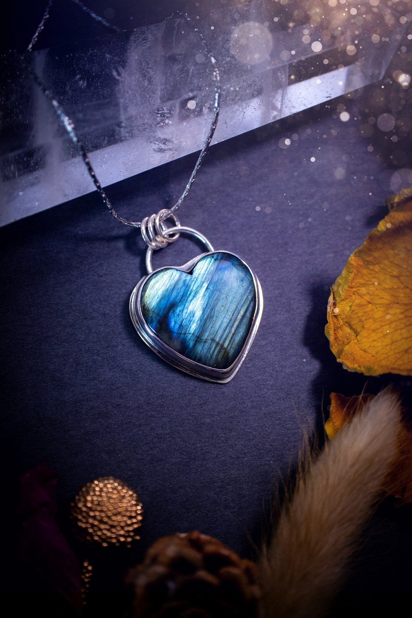 Bold and beautiful, blue and green flash, Labradorite crystal heart pendant necklace. This pendant has been handcrafted out of fine and sterling silver. The piece is minimal yet unique. Suitable for jewellery gifts. Gothic, hippy and ideal for her.