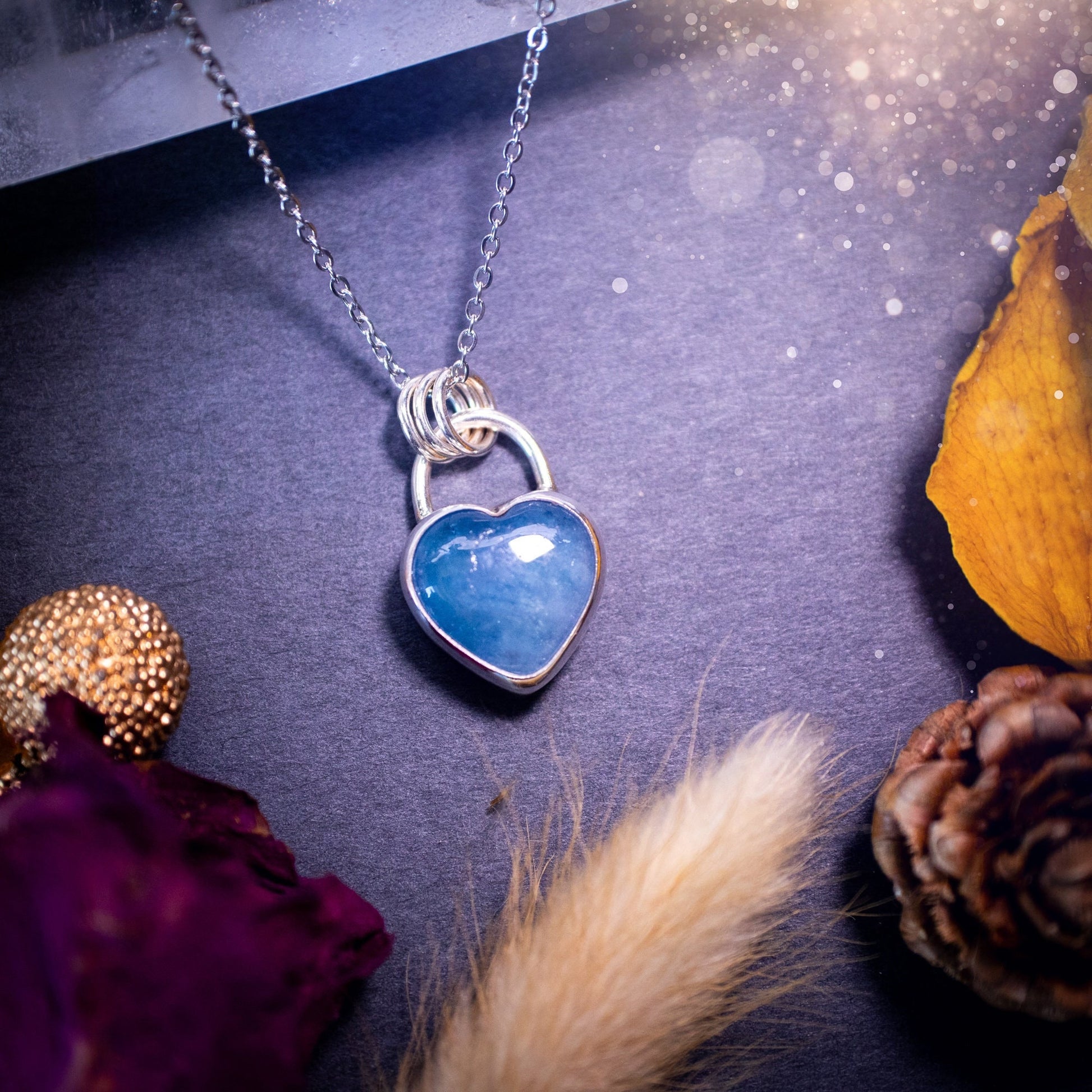 Bold and beautiful, blue aquamarine crystal heart pendant necklace. This pendant has been handcrafted out of fine and sterling silver. The piece is minimal yet unique. Suitable for jewellery gifts. Gothic, hippy and ideal for her. March birthstone