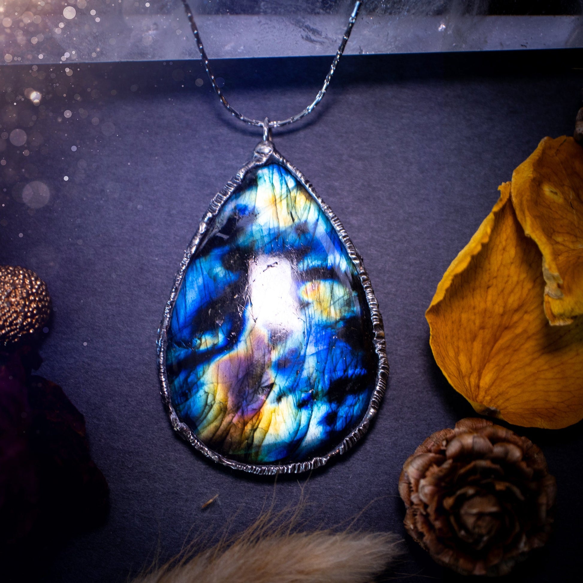 Beautiful, flashy labradorite crystal which has been soft soldered to create a stunning pendant necklace. Natural crystal gemstone with lead free solder, a beautiful gift for any crystal lover. Witchy and gothic style jewellery, gifts for her.