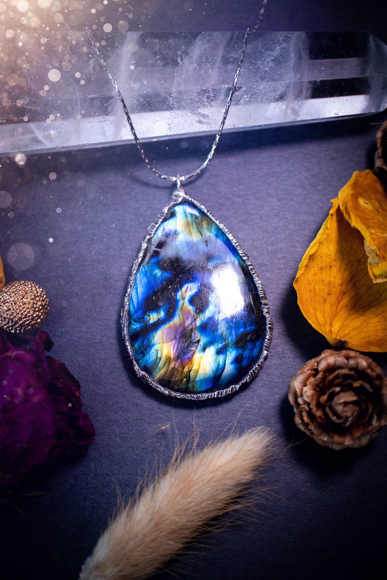 Beautiful, flashy labradorite crystal which has been soft soldered to create a stunning pendant necklace. Natural crystal gemstone with lead free solder, a beautiful gift for any crystal lover. Witchy and gothic style jewellery, gifts for her.