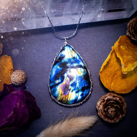 Beautiful, flashy labradorite crystal which has been soft soldered to create a stunning pendant necklace. Natural crystal gemstone with lead free solder, a beautiful gift for any crystal lover. Witchy and gothic style jewellery, gifts for her.