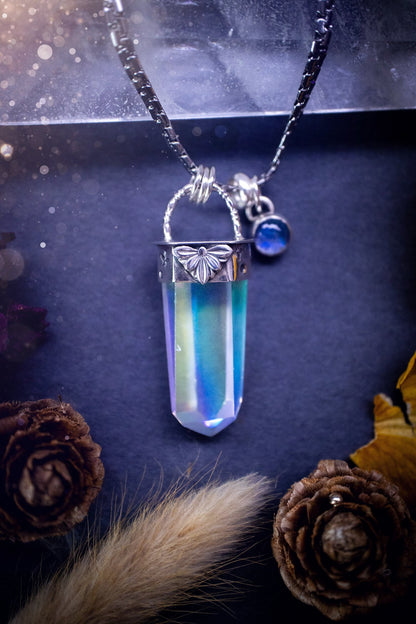 Beautiful, handmade aura quartz crystal point pendant necklace with rainbow moonstone charm. This pendant is a statement and has been handcrafted out of recycled fine and sterling silver. Featuring star stamp detail. Ideal for crystal lovers, gothic