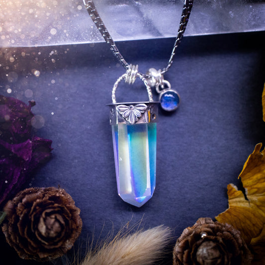 Beautiful, handmade aura quartz crystal point pendant necklace with rainbow moonstone charm. This pendant is a statement and has been handcrafted out of recycled fine and sterling silver. Featuring star stamp detail. Ideal for crystal lovers, gothic