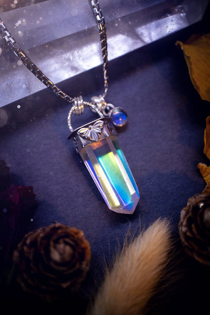 Beautiful, handmade aura quartz crystal point pendant necklace with rainbow moonstone charm. This pendant is a statement and has been handcrafted out of recycled fine and sterling silver. Featuring star stamp detail. Ideal for crystal lovers, gothic