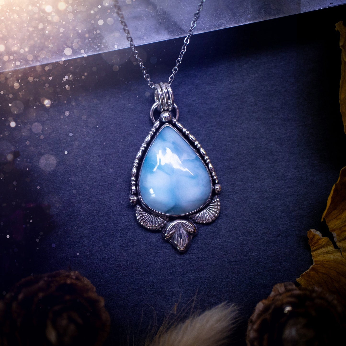 Unique and handmade, larimar pendant necklace. This Pendant has been made from recycled sterling silver and features scallop and leaf accents. The larimar is A grade quality and would make the ideal gift for jewellery and crystal lovers.