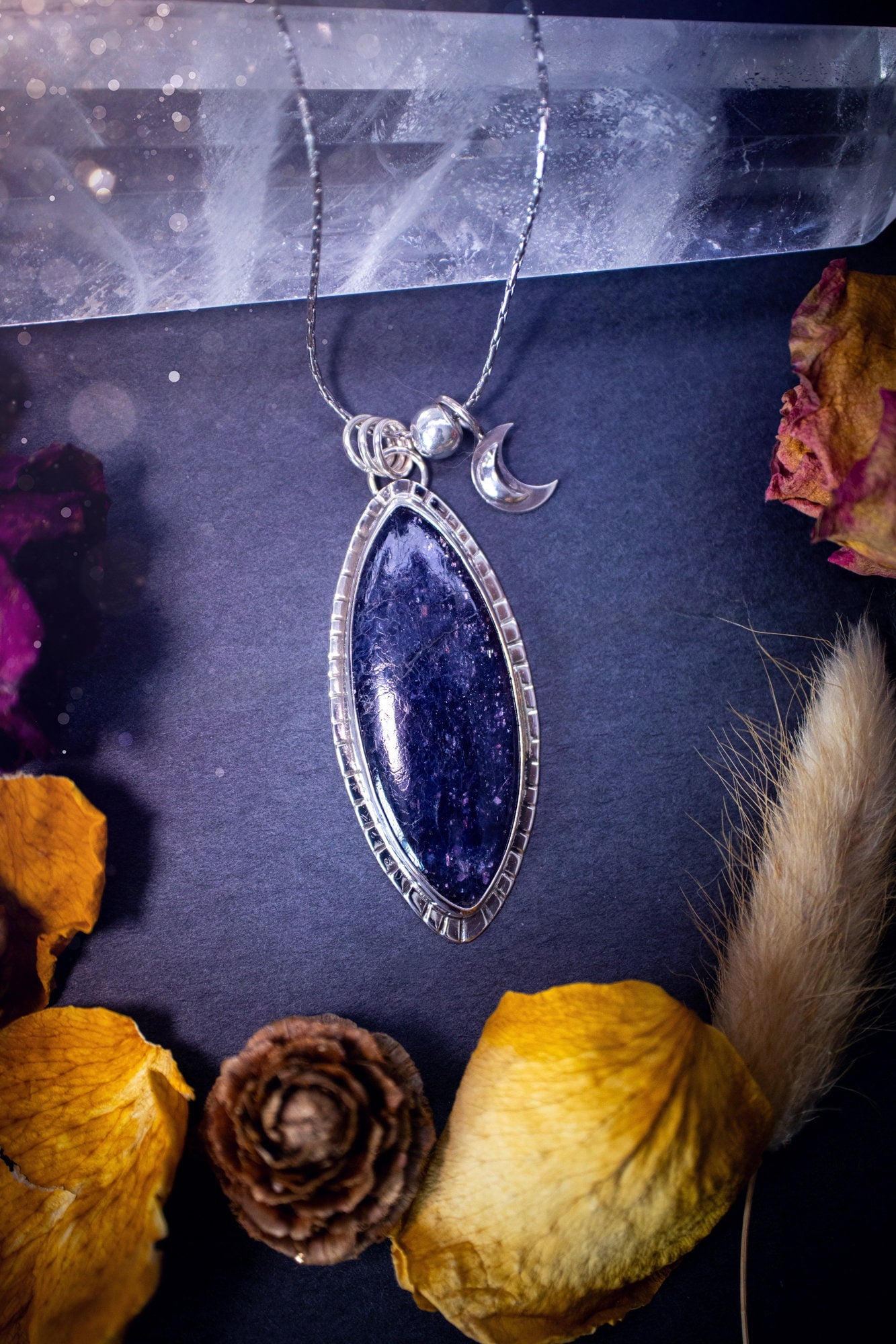 Handcrafted, beautiful, Iolite Sunstone crystal pendant necklace. Featuring a gorgeous sparkly Iolite gemstone, and made from recycled sterling silver. Accompanied by a little moon charm. Ideal gift for crystal and jewellery lovers. Hippy and Gothic