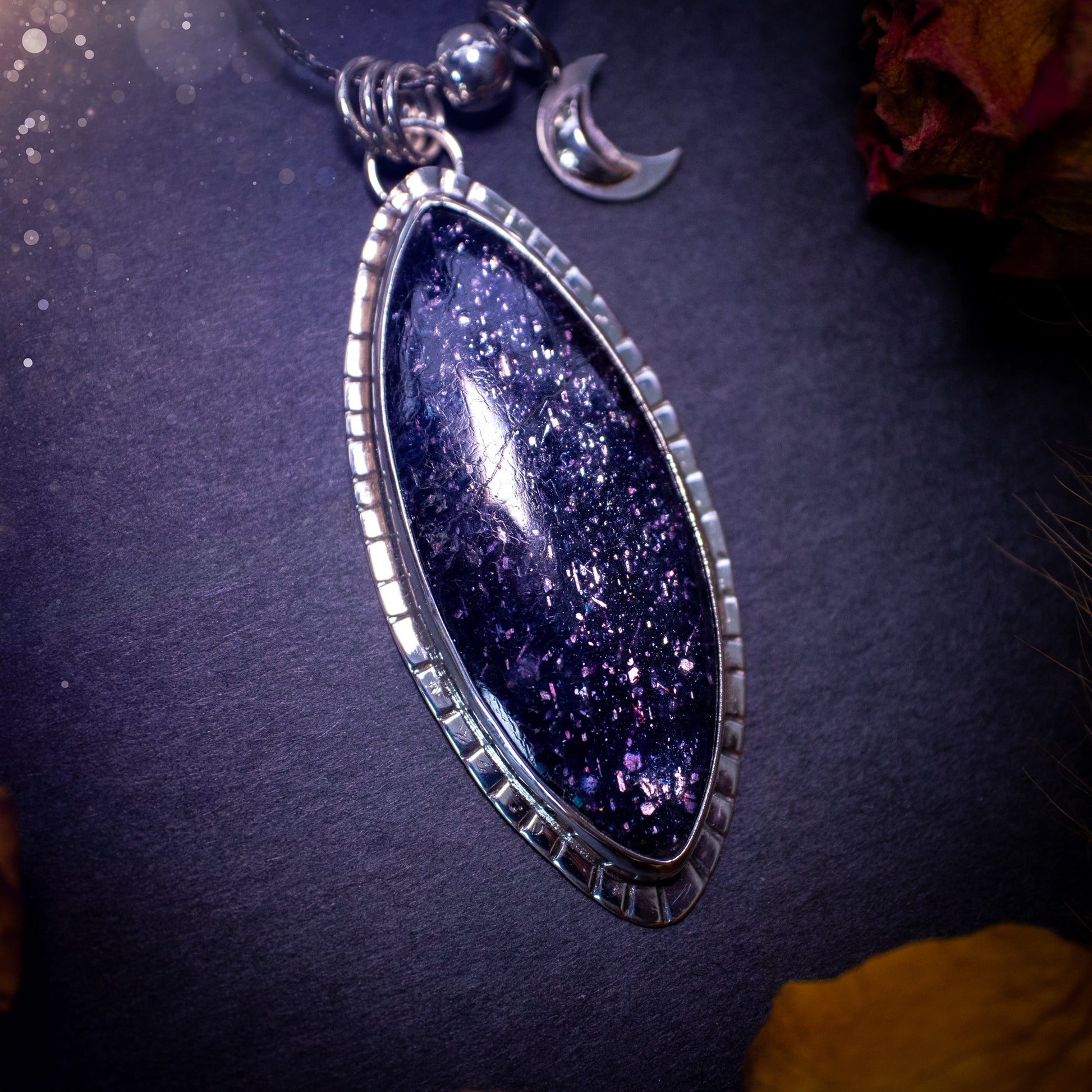 Handcrafted, beautiful, Iolite Sunstone crystal pendant necklace. Featuring a gorgeous sparkly Iolite gemstone, and made from recycled sterling silver. Accompanied by a little moon charm. Ideal gift for crystal and jewellery lovers. Hippy and Gothic