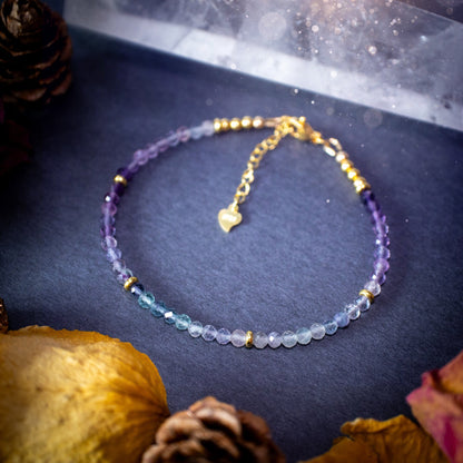 Stunning and natural, 3mm beaded fluorite crystal stacking bracelet. This bracelet is made using high quality fluorite beads which are faceted for extra sparkle. Strung on 49 strand beading wire for the perfect drape. Ideal gift for her.