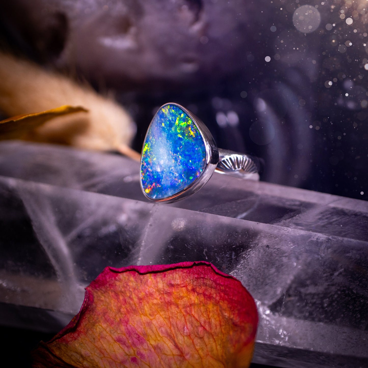 Beautiful and flashy, Australian Opal Doublet ring. Set in sterling and fine silver, this ring will make the ideal gift for that special person. Full of reds, greens, and blues in the natural crystal opal, with stamped ring shank. Size O 1/2