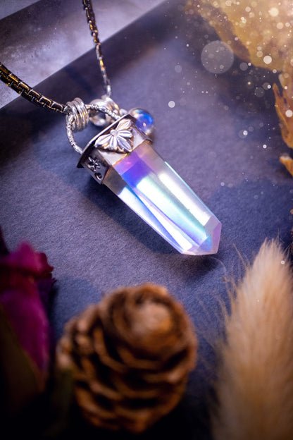 Beautiful, handmade aura quartz crystal point pendant necklace with rainbow moonstone charm. This pendant is a statement and has been handcrafted out of recycled fine and sterling silver. Featuring star stamp detail. Ideal for crystal lovers, gothic