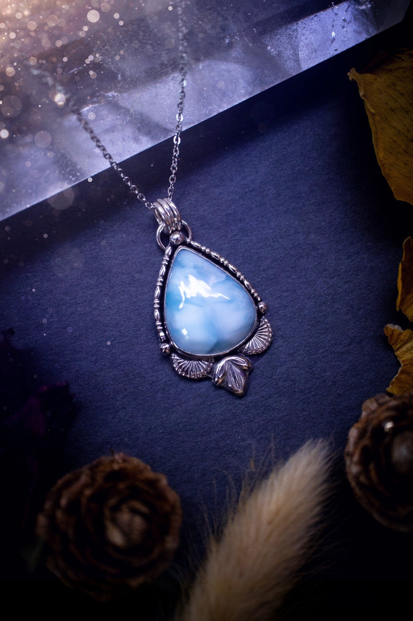 Unique and handmade, larimar pendant necklace. This Pendant has been made from recycled sterling silver and features scallop and leaf accents. The larimar is A grade quality and would make the ideal gift for jewellery and crystal lovers.