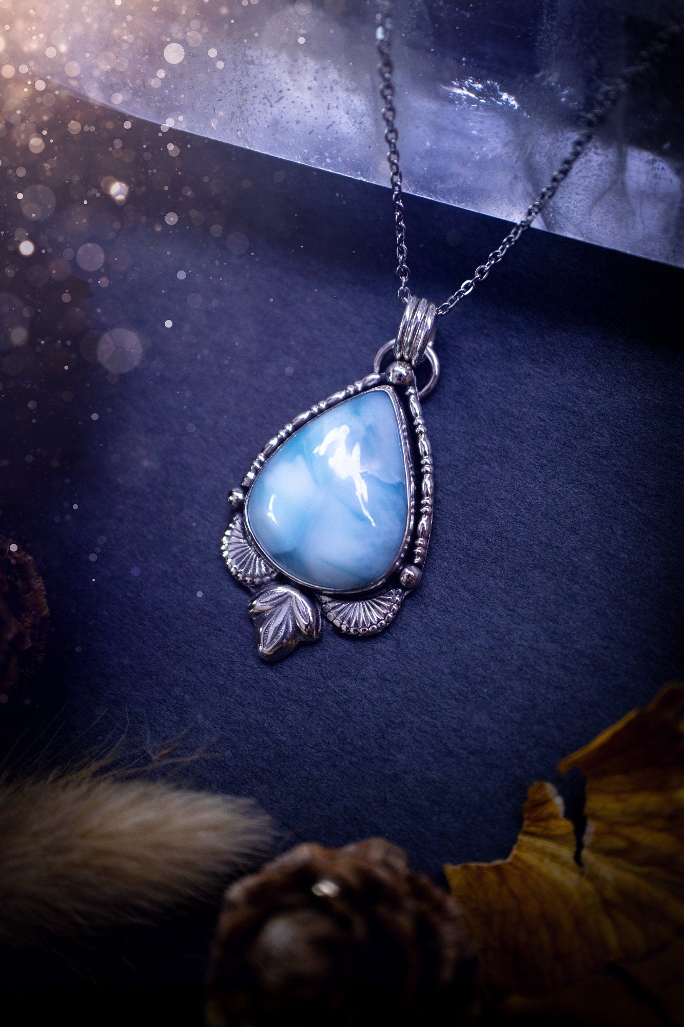 Unique and handmade, larimar pendant necklace. This Pendant has been made from recycled sterling silver and features scallop and leaf accents. The larimar is A grade quality and would make the ideal gift for jewellery and crystal lovers.