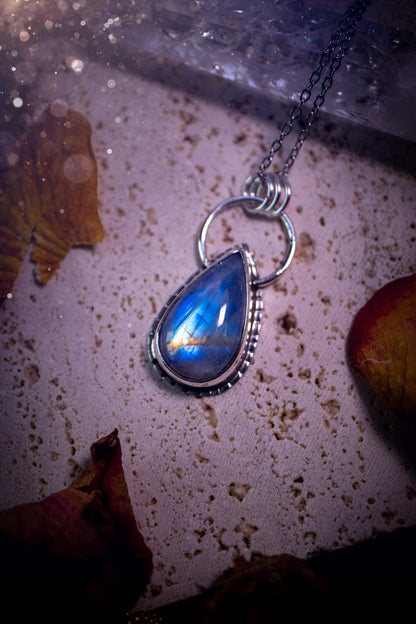 Stunning and handcrafted, very blue and flashy Rainbow moonstone. This one of a kind pendant has been made using recycled sterling silver and fine silver, accompanied by a thick outer bezel that has been stamped to make it unique. Ideal gift for her.