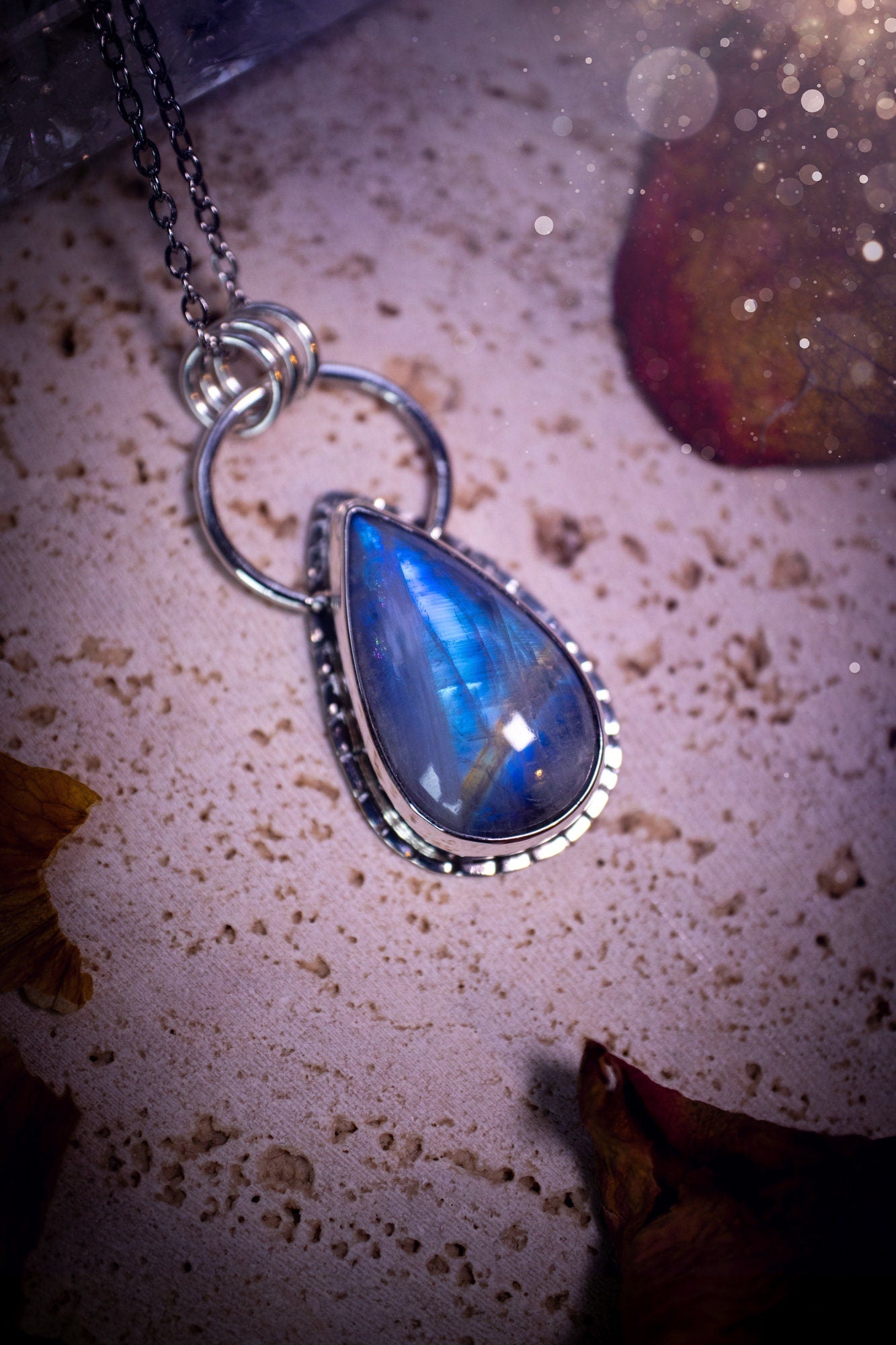 Stunning and handcrafted, very blue and flashy Rainbow moonstone. This one of a kind pendant has been made using recycled sterling silver and fine silver, accompanied by a thick outer bezel that has been stamped to make it unique. Ideal gift for her.