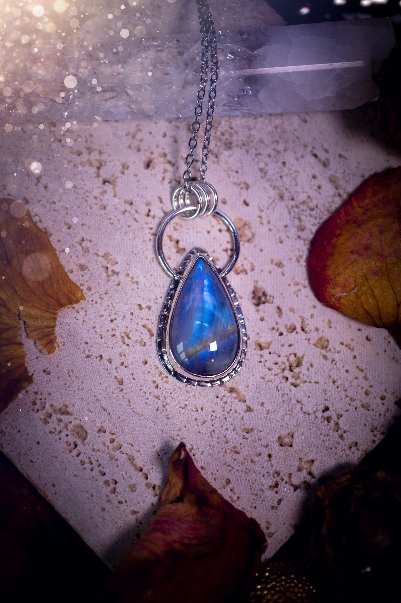 Stunning and handcrafted, very blue and flashy Rainbow moonstone. This one of a kind pendant has been made using recycled sterling silver and fine silver, accompanied by a thick outer bezel that has been stamped to make it unique. Ideal gift for her.