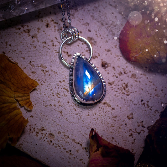 Stunning and handcrafted, Rainbow moonstone. This one of a kind pendant has been made using recycled sterling silver and fine silver, accompanied by a thick outer bezel that has been stamped to make it unique. Ideal gift for her and crystal lovers.