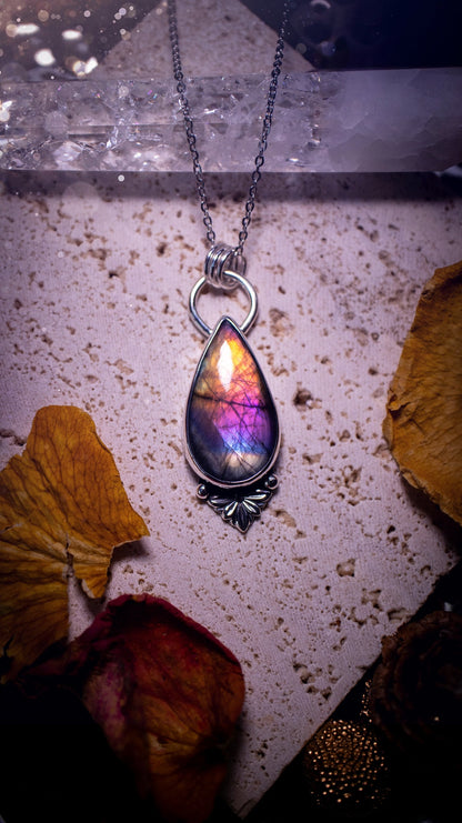 One of a kind and handcrafted, spectrolite labradorite pendant necklace. Featuring the most beautifully coloured crystal gemstone, full of rainbow colours. Handmade using recycled sterling silver complete with fan components. Healing jewellery, goth.