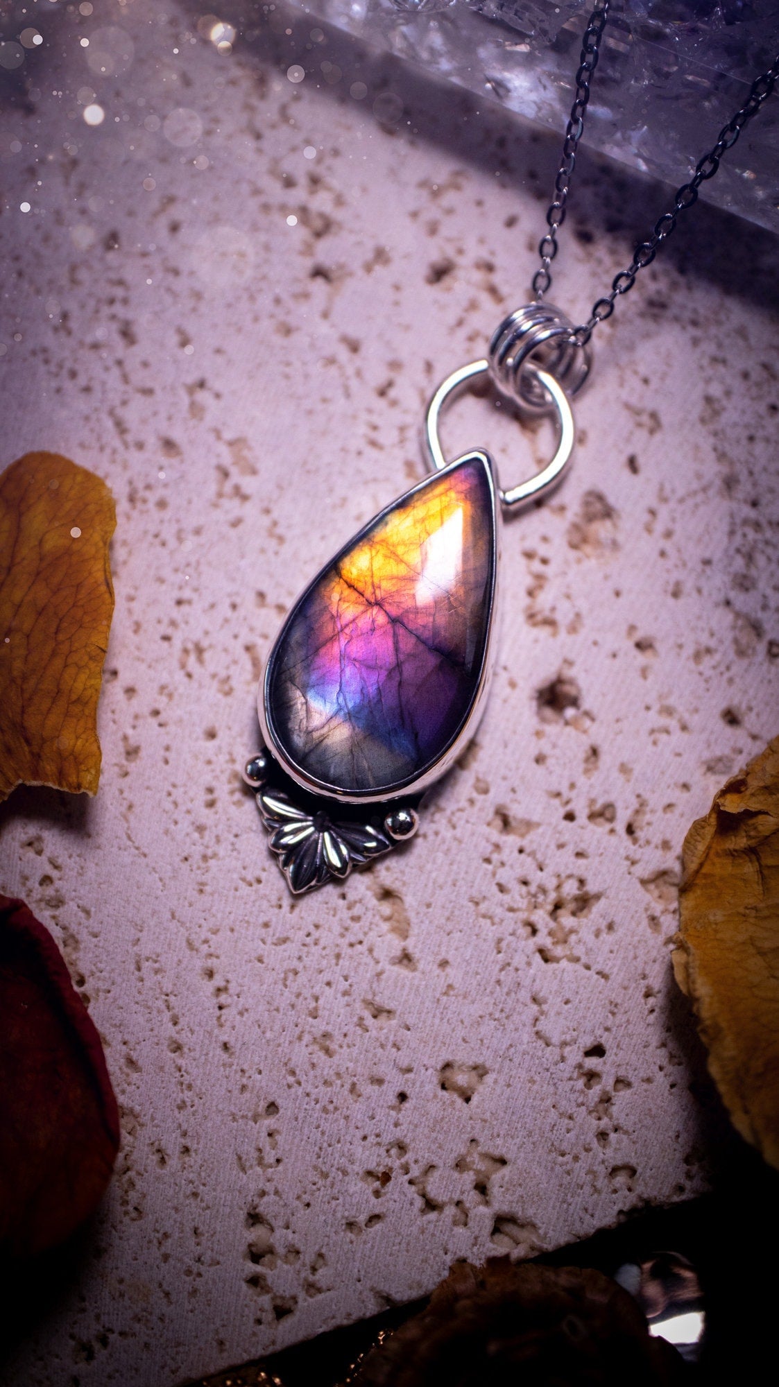 One of a kind and handcrafted, spectrolite labradorite pendant necklace. Featuring the most beautifully coloured crystal gemstone, full of rainbow colours. Handmade using recycled sterling silver complete with fan components. Healing jewellery, goth.