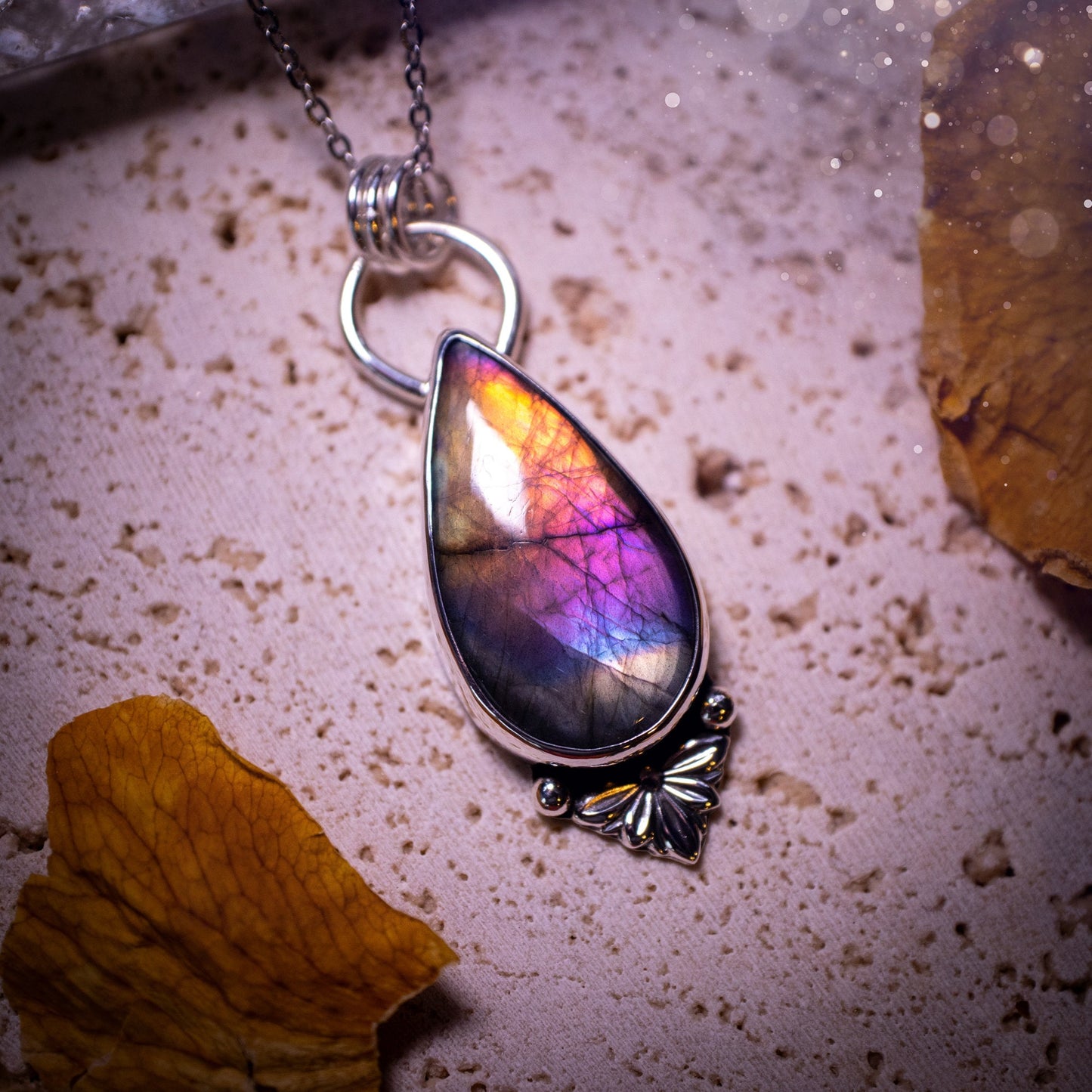 One of a kind and handcrafted, spectrolite labradorite pendant necklace. Featuring the most beautifully coloured crystal gemstone, full of rainbow colours. Handmade using recycled sterling silver complete with fan components. Healing jewellery, goth.