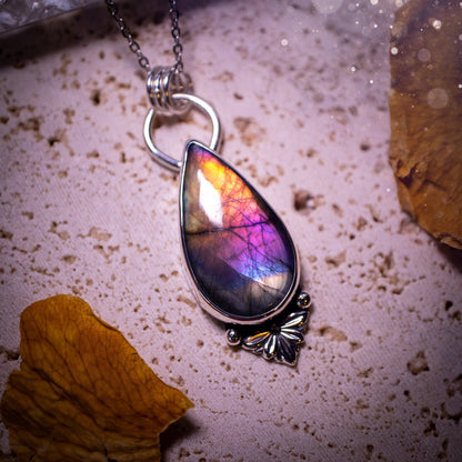 One of a kind and handcrafted, spectrolite labradorite pendant necklace. Featuring the most beautifully coloured crystal gemstone, full of rainbow colours. Handmade using recycled sterling silver complete with fan components. Healing jewellery, goth.