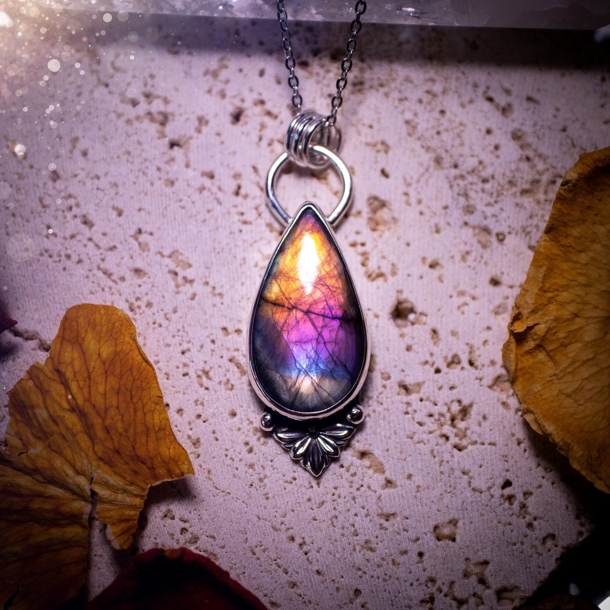 One of a kind and handcrafted, spectrolite labradorite pendant necklace. Featuring the most beautifully coloured crystal gemstone, full of rainbow colours. Handmade using recycled sterling silver complete with fan components. Healing jewellery, goth.