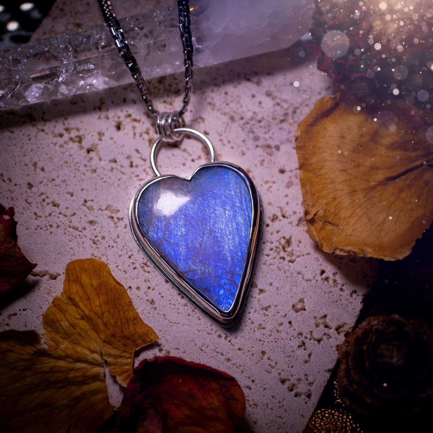 Bold and beautiful, blue flash, belomorite moonstone crystal heart pendant necklace. This pendant has been handcrafted out of fine and sterling silver. The piece is minimal yet unique. Suitable for jewellery gifts. Gothic, hippy and ideal for her.