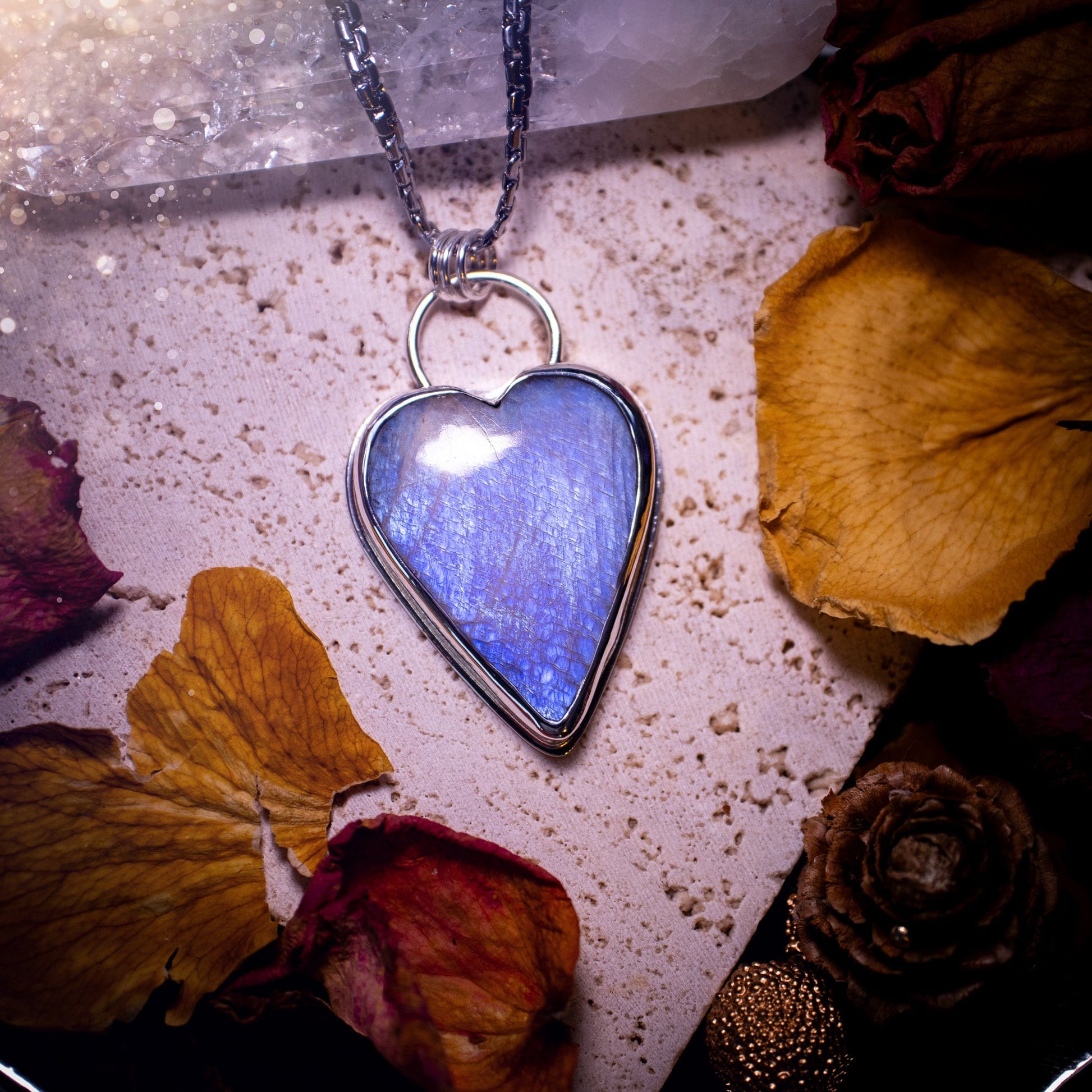 Bold and beautiful, blue flash, belomorite moonstone crystal heart pendant necklace. This pendant has been handcrafted out of fine and sterling silver. The piece is minimal yet unique. Suitable for jewellery gifts. Gothic, hippy and ideal for her.