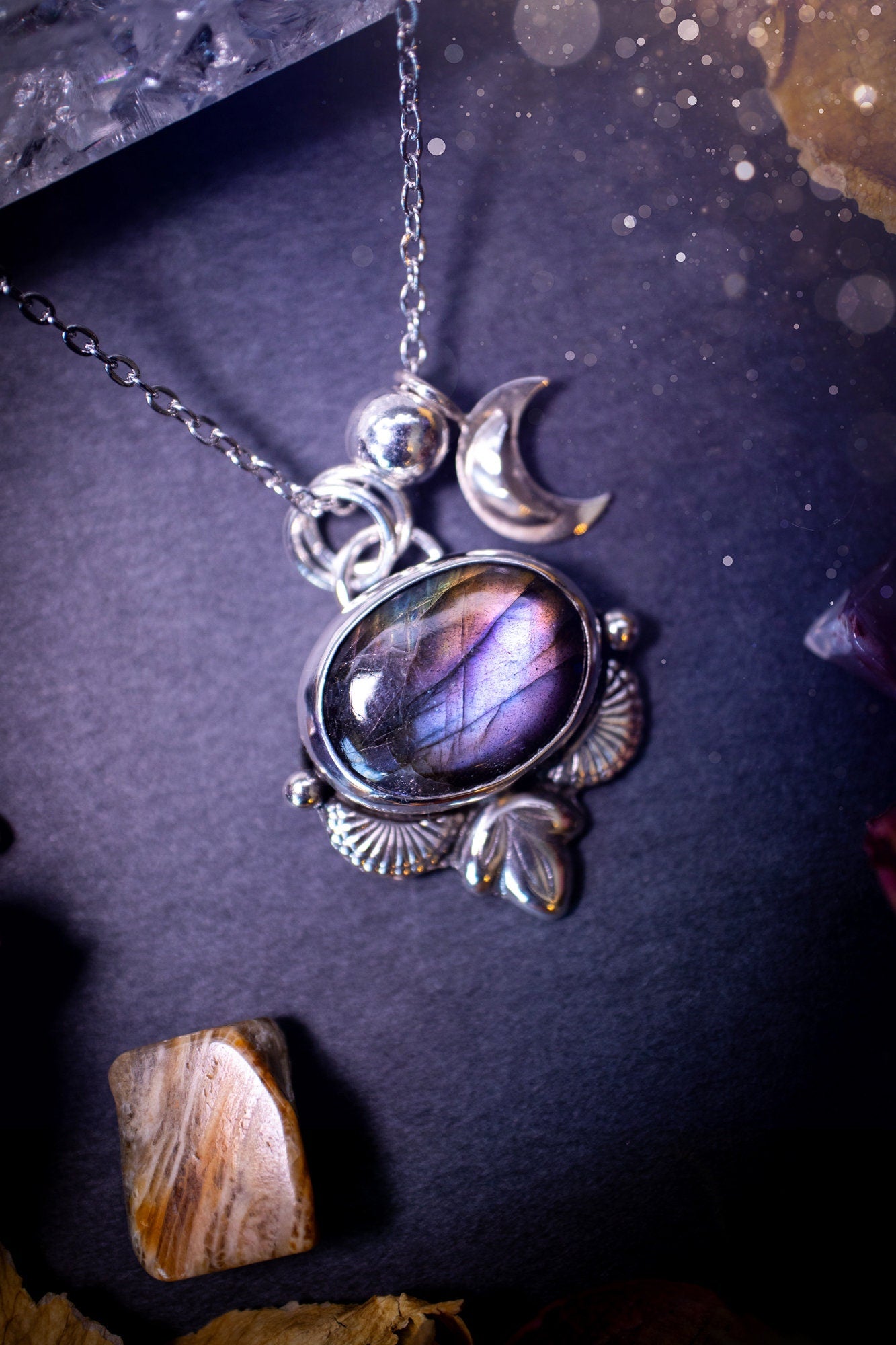 Handcrafted, purple, blue and orange labradorite pendant. This crystal pendant necklace has been crafted from recycled sterling silver and features unique silver botanical accents and balls. There is a little silver moon charm also. Gifts for her.