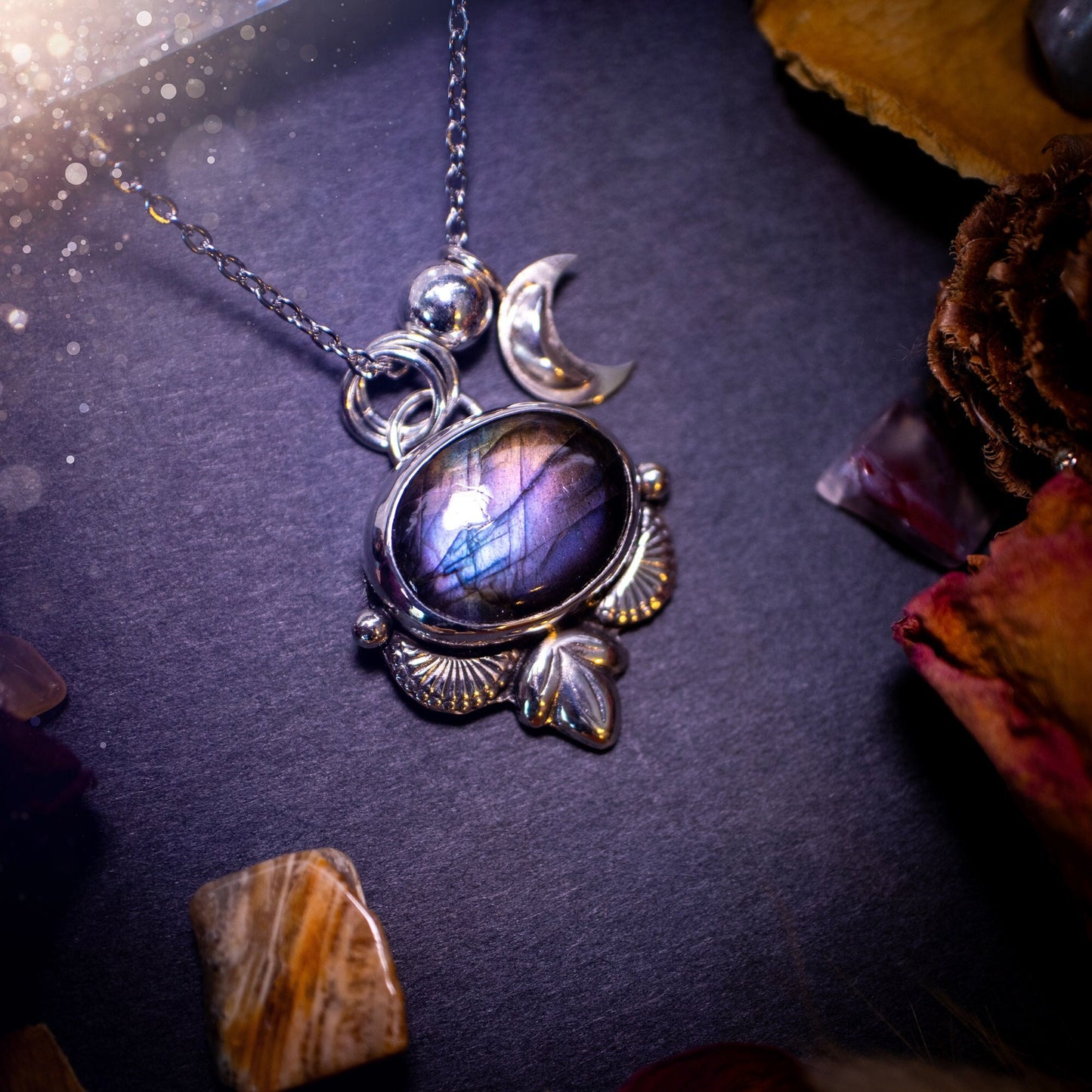 Handcrafted, purple, blue and orange labradorite pendant. This crystal pendant necklace has been crafted from recycled sterling silver and features unique silver botanical accents and balls. There is a little silver moon charm also. Gifts for her.