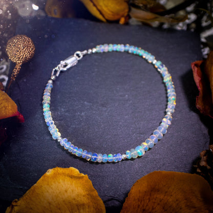 Bold and stunning, Ethiopian Welo Opal stacking Bracelet. This bracelet has been made using the finest opals which are full of beautiful colours and sparkles. Strung on durable yet flexible 49 strand beading wire. Crystal gifts for her.