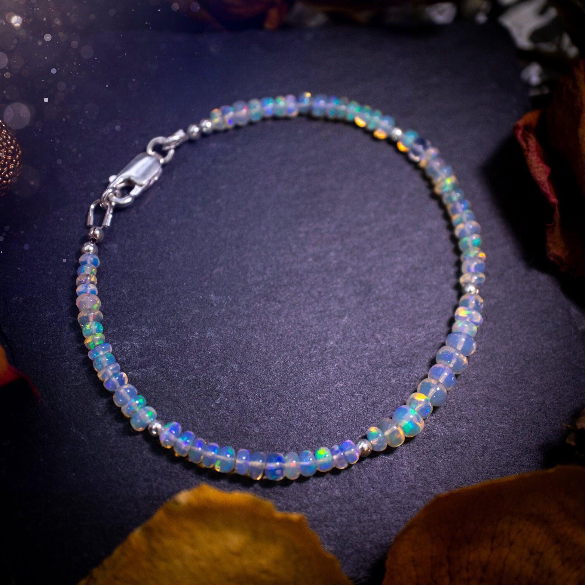 Bold and stunning, Ethiopian Welo Opal stacking Bracelet. This bracelet has been made using the finest opals which are full of beautiful colours and sparkles. Strung on durable yet flexible 49 strand beading wire. Crystal gifts for her.