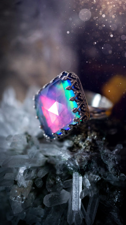 Truly unique and regal, sterling silver, aurora opal stacking ring. This ring has been handmade with a very colourful aurora opal that is full of pinks, greens and blues. Mounted on a plain ring shank, featuring regal gallery bezel around the gem