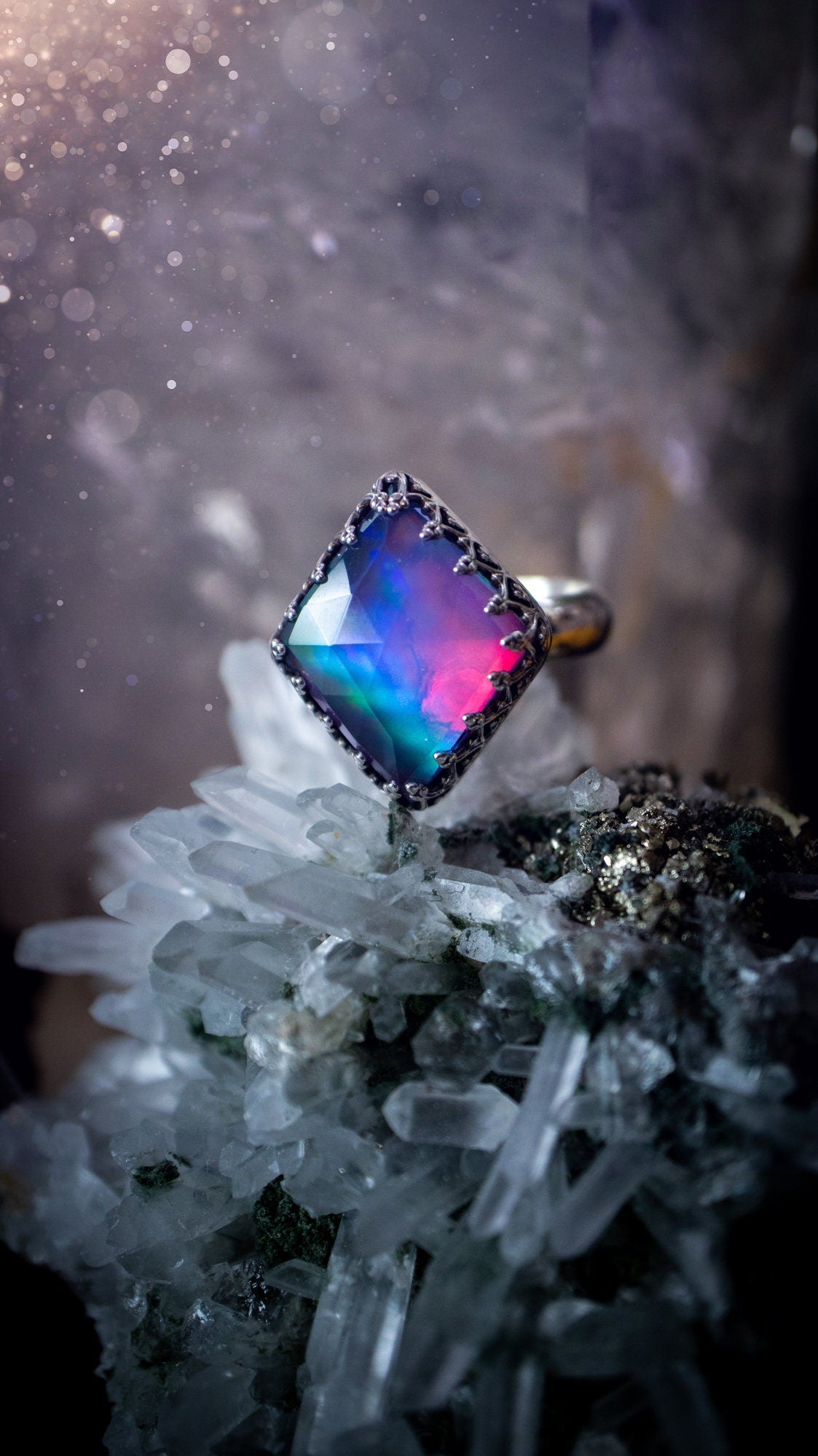 Truly unique and regal, sterling silver, aurora opal stacking ring. This ring has been handmade with a very colourful aurora opal that is full of pinks, greens and blues. Mounted on a plain ring shank, featuring regal gallery bezel around the gem