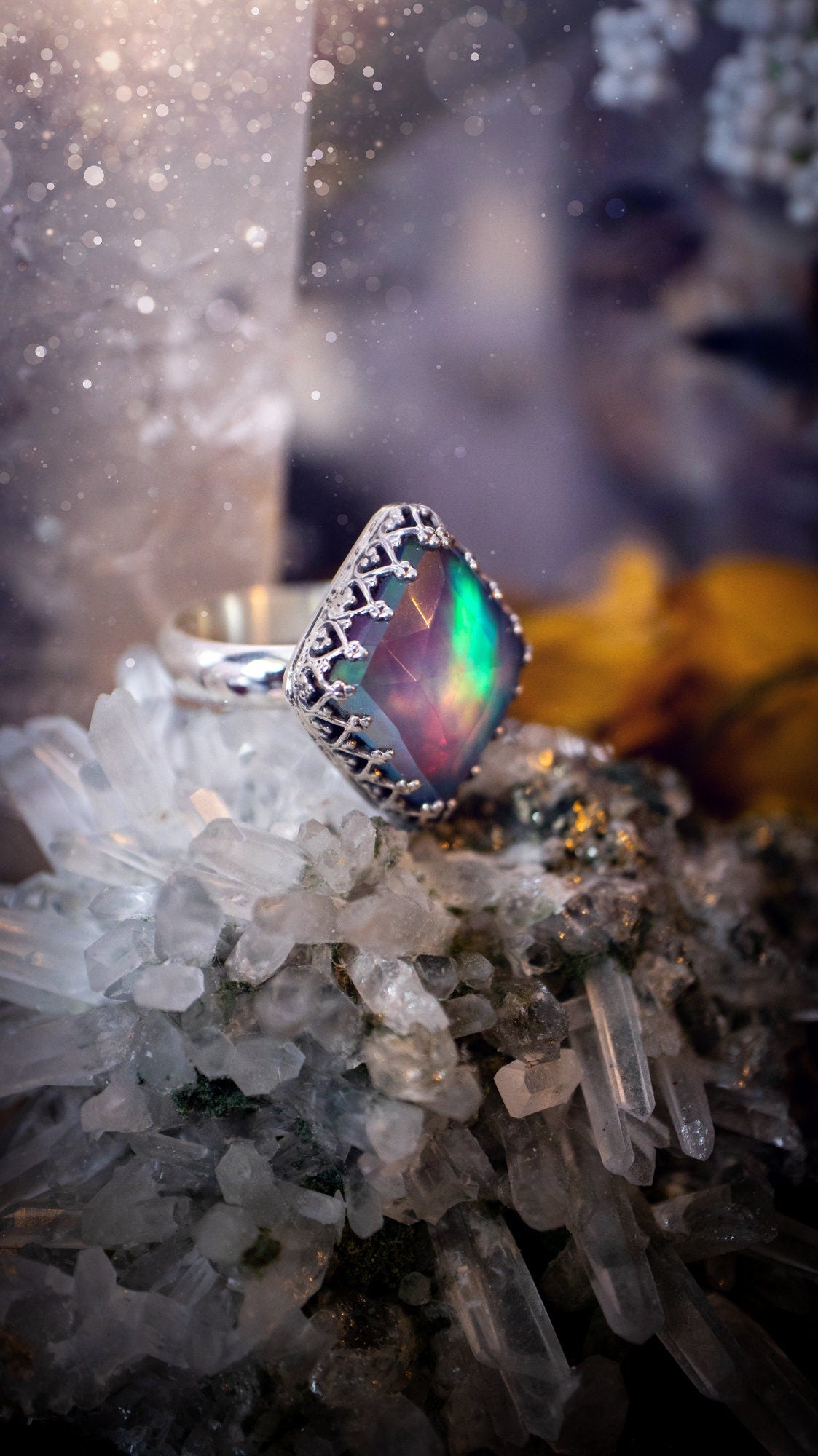 Truly unique and regal, sterling silver, aurora opal stacking ring. This ring has been handmade with a very colourful aurora opal that is full of pinks, greens and blues. Mounted on a plain ring shank, featuring regal gallery bezel around the gem