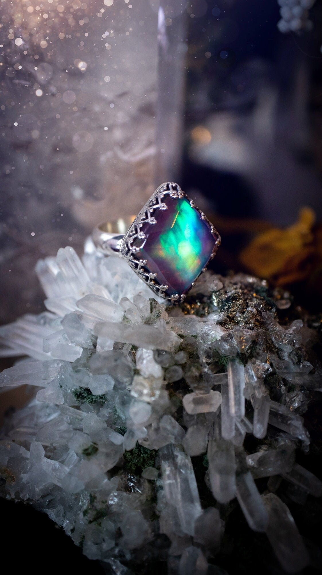 Truly unique and regal, sterling silver, aurora opal stacking ring. This ring has been handmade with a very colourful aurora opal that is full of pinks, greens and blues. Mounted on a plain ring shank, featuring regal gallery bezel around the gem