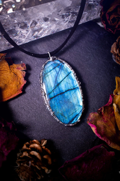 Beautiful, flashy blue labradorite crystal which has been soft soldered to create a stunning pendant. Natural crystal gemstone with lead free solder, a beautiful gift for any crystal lover. This piece of jewellery can be used for healing purposes.