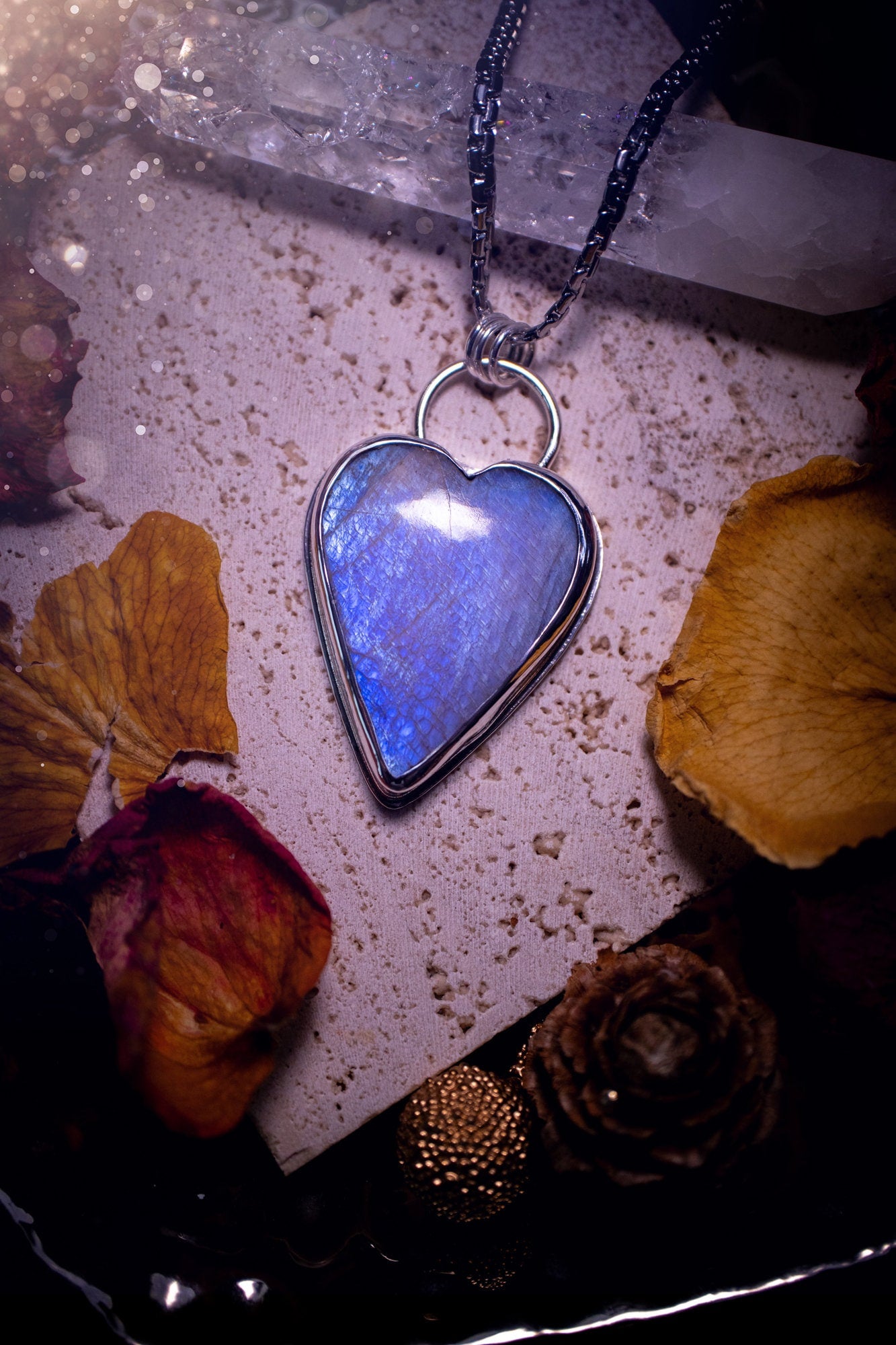 Bold and beautiful, blue flash, belomorite moonstone crystal heart pendant necklace. This pendant has been handcrafted out of fine and sterling silver. The piece is minimal yet unique. Suitable for jewellery gifts. Gothic, hippy and ideal for her.