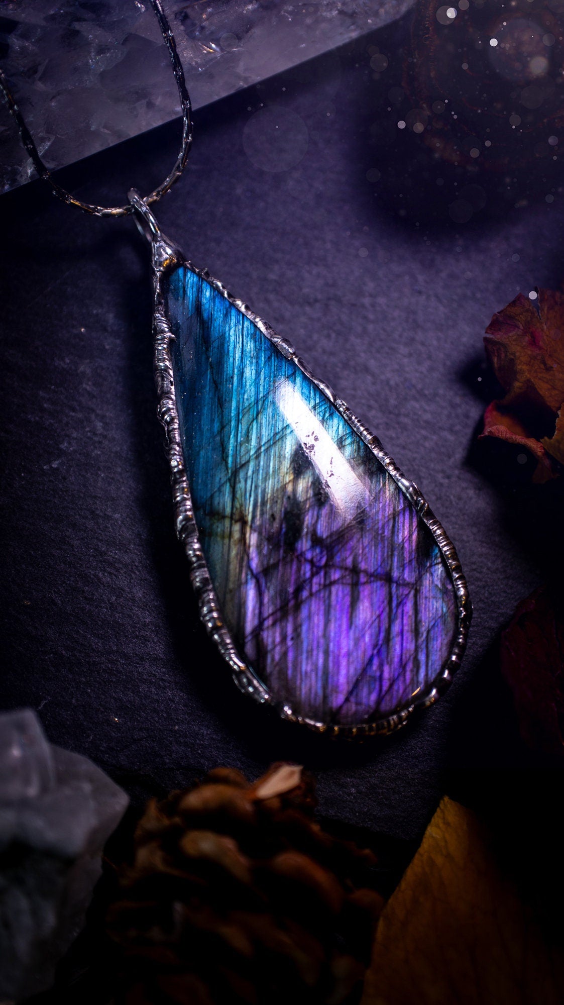 Beautiful, blue and purple labradorite crystal which has been soft soldered to create a stunning pendant. Natural crystal gemstone with lead free solder, a beautiful gift for any crystal lover. This piece of jewellery can be used for healing. Gothic